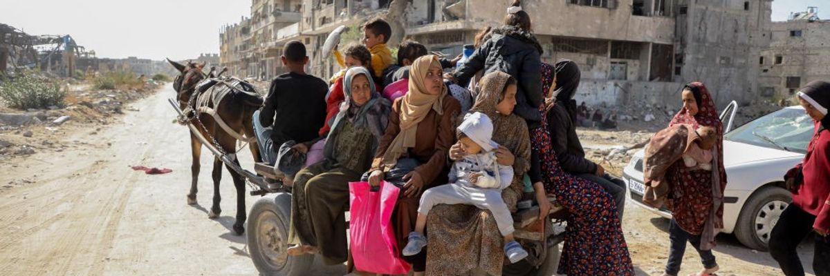 Palestinian women and children flee from obliterated Jabalia by donkey cart