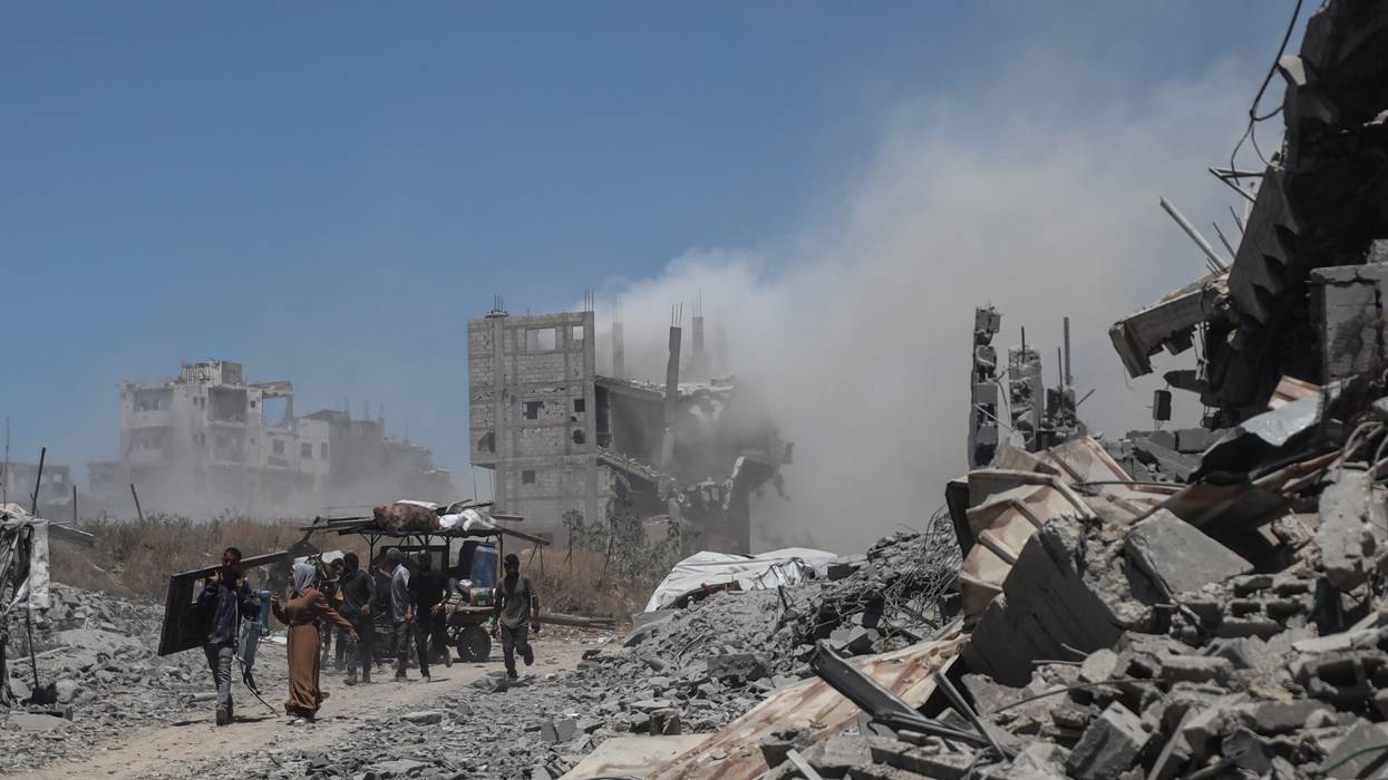 Palestinians are seen returning to their homes in Gaza City, Gaza