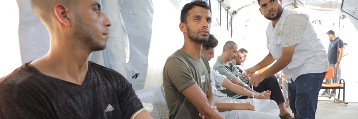 Palestinians arrive to donate blood