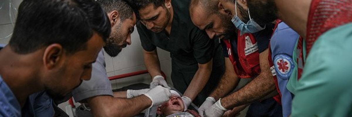 Palestinians attend injured baby in Al-Nasir Hospital in Khan Yunis, Gaza
