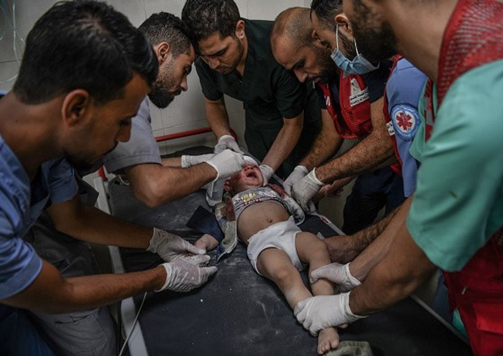 Palestinians attend injured baby in Al-Nasir Hospital  in Khan Yunis, Gaza