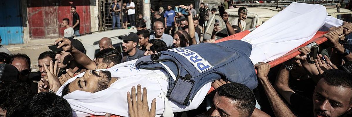 Palestinians attend the funeral of journalist Saleh al-Jafarawi