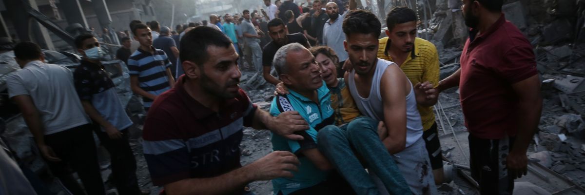 Palestinians evacuate an injured girl in Gaza