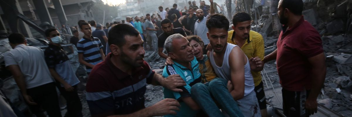 Palestinians evacuate an injured girl in Gaza