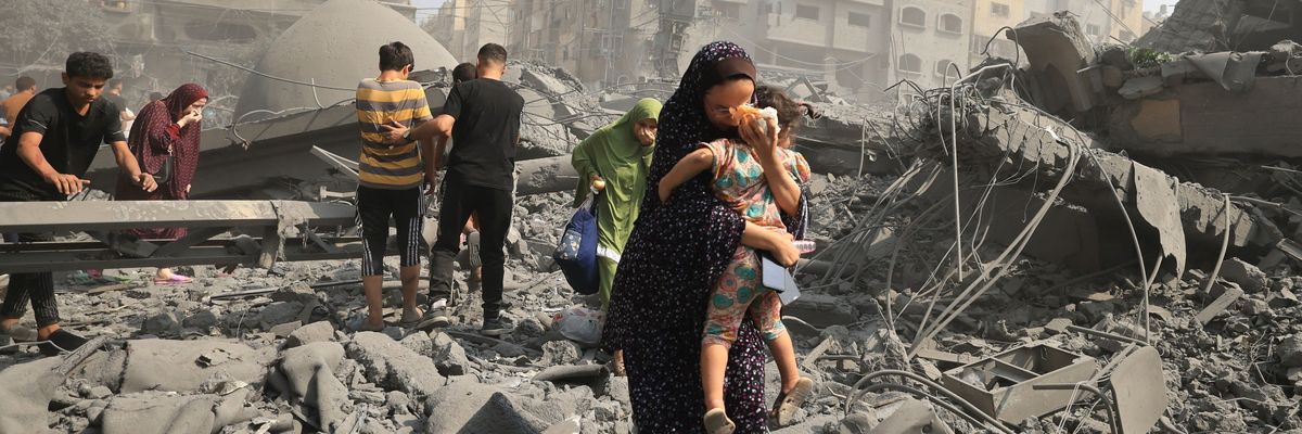 Palestinians evacuate following an Israeli airstrike on Gaza
