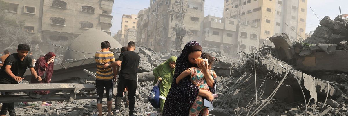 Palestinians evacuate following an Israeli airstrike