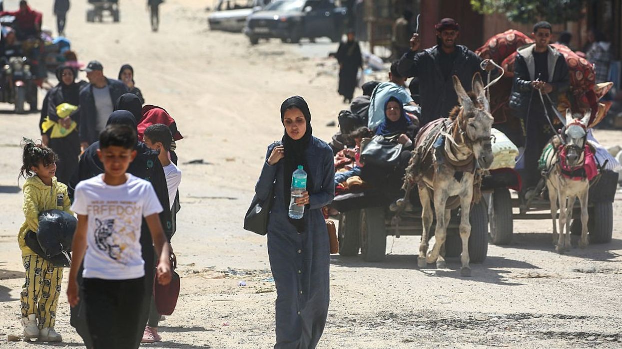 Palestinians flee Rafah in Gaza on foot and donkey cart