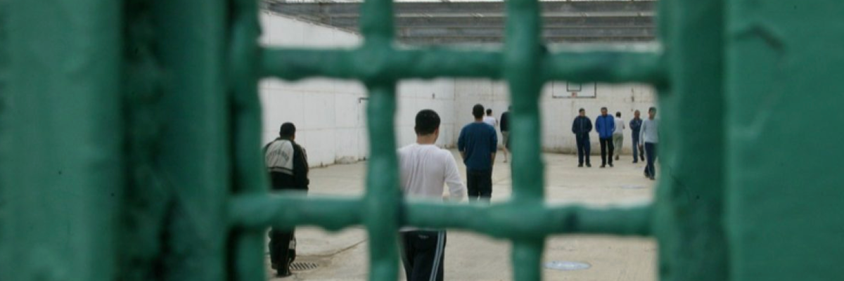 Palestinians imprisoned by Israel stand in a recreational area