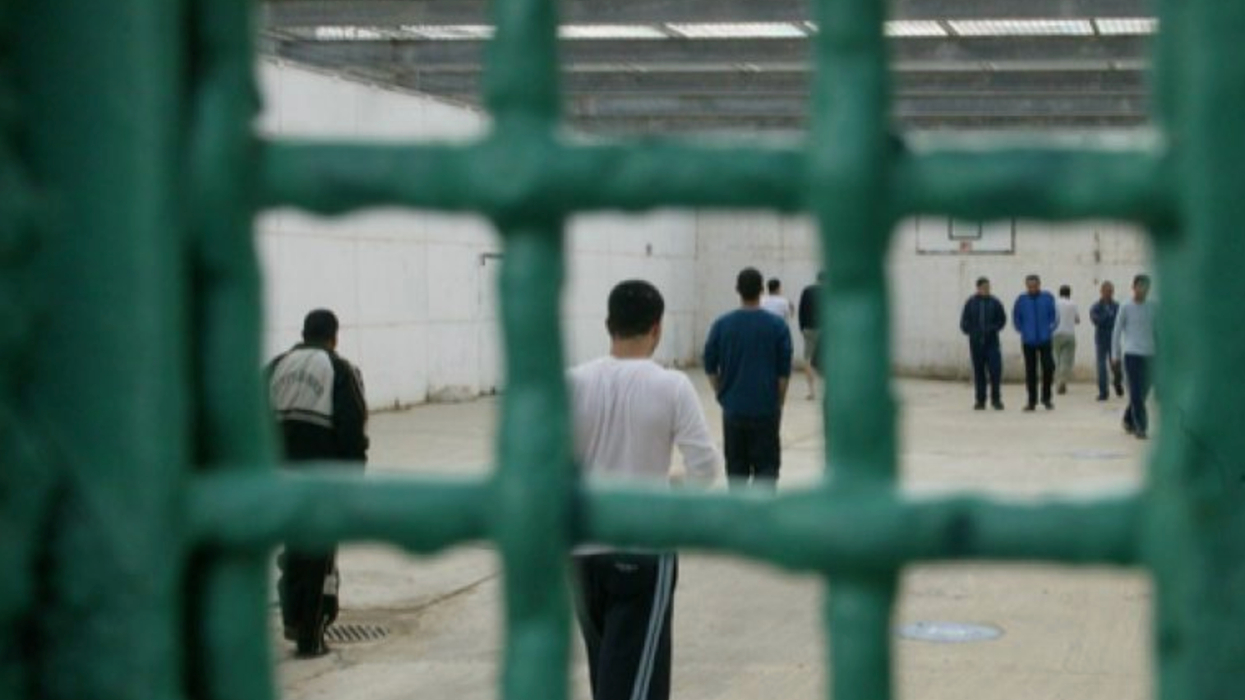 Palestinians imprisoned by Israel stand in a recreational area