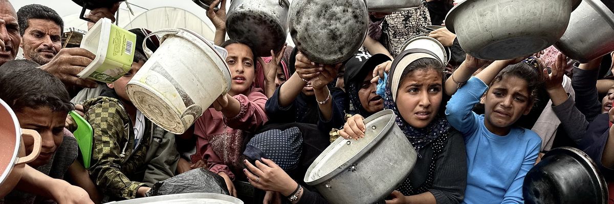 Palestinians in Gaza waiting for food to be distributed.