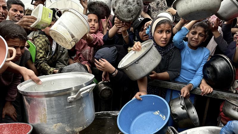 Palestinians in Gaza waiting for food to be distributed.