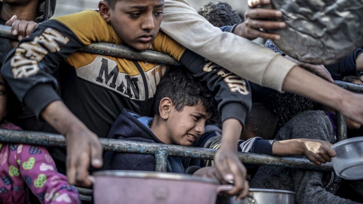 Palestinians in Rafah, Gaza, receive food
