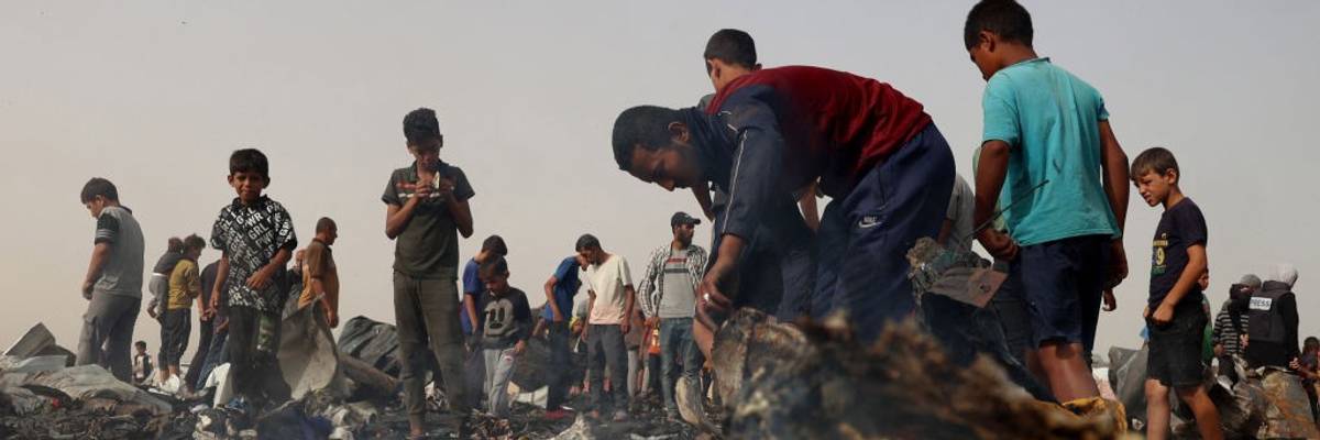 Palestinians in the aftermath of massacre on Rafah tent encampent on May 27, 2024