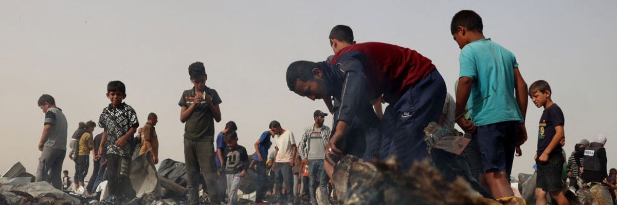 Palestinians in the aftermath of massacre on Rafah tent encampent on May 27, 2024