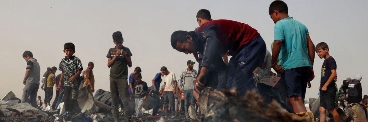 Palestinians in the aftermath of massacre on Rafah tent encampent on May 27, 2024