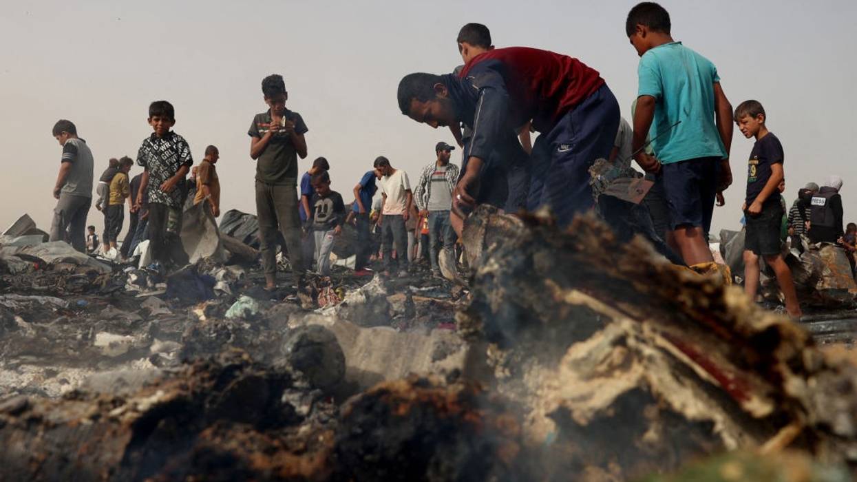 Palestinians in the aftermath of massacre on Rafah tent encampent on May 27, 2024