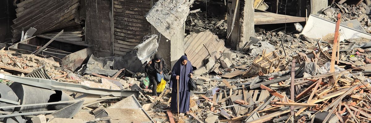 Palestinians inspect the destruction of Kamal Adwan hospital
