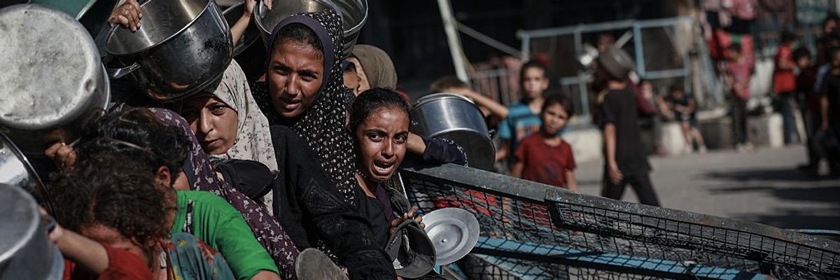 Palestinians line up to receive foot