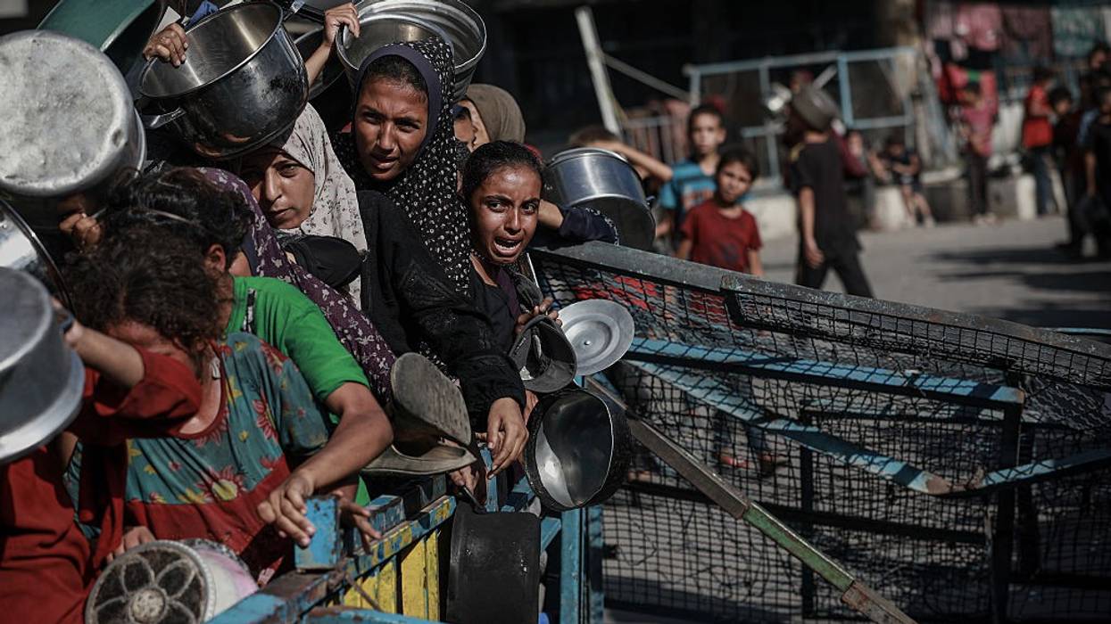 Palestinians line up to receive foot