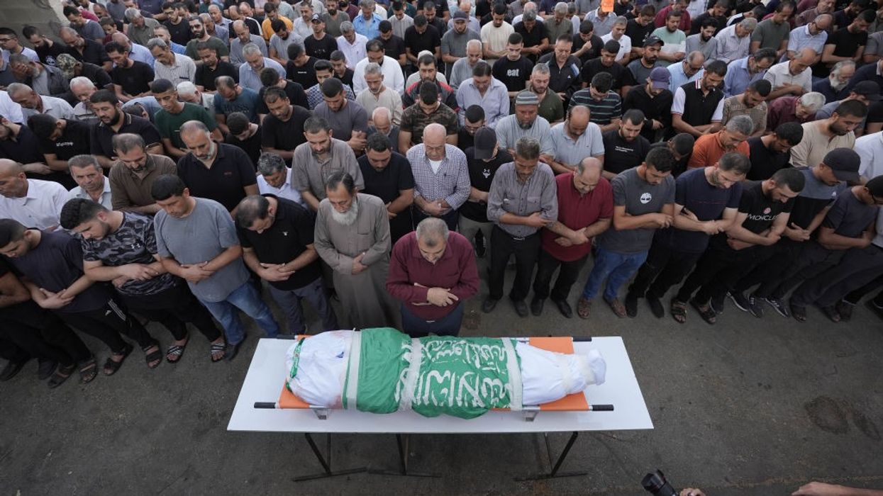 Palestinians mourn a child killed by Israeli occupation forces in the West Bank city of Jenin