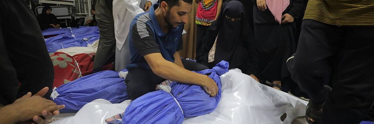 Palestinians mourn dead relatives killled by Israeli strikes