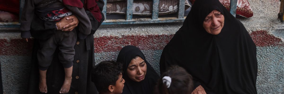 Palestinians mourn more deaths from an Israel airstrike on UNRWA school in Nuseirat Refugee Camp,