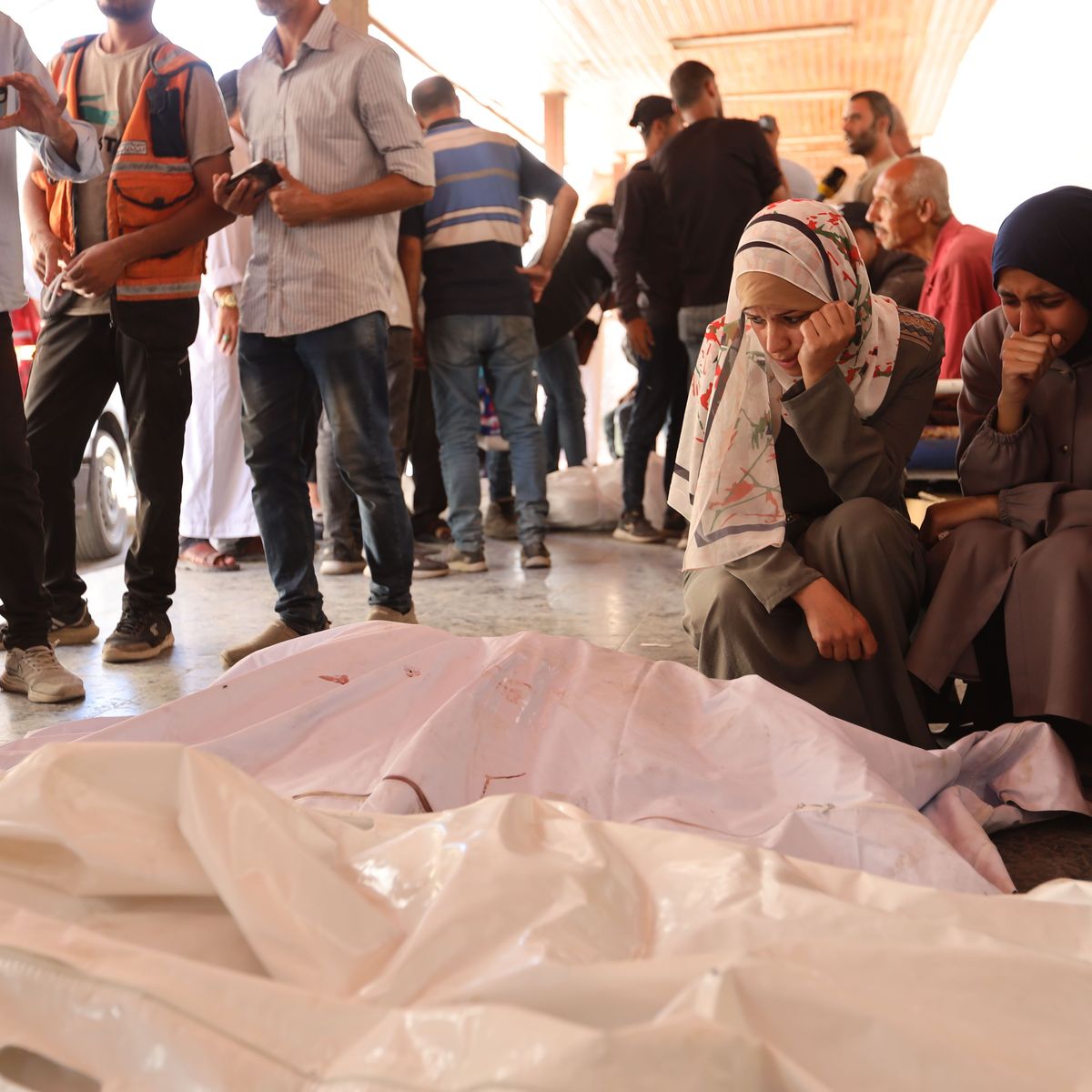 Palestinians mourn relatives killed by an Israeli attack