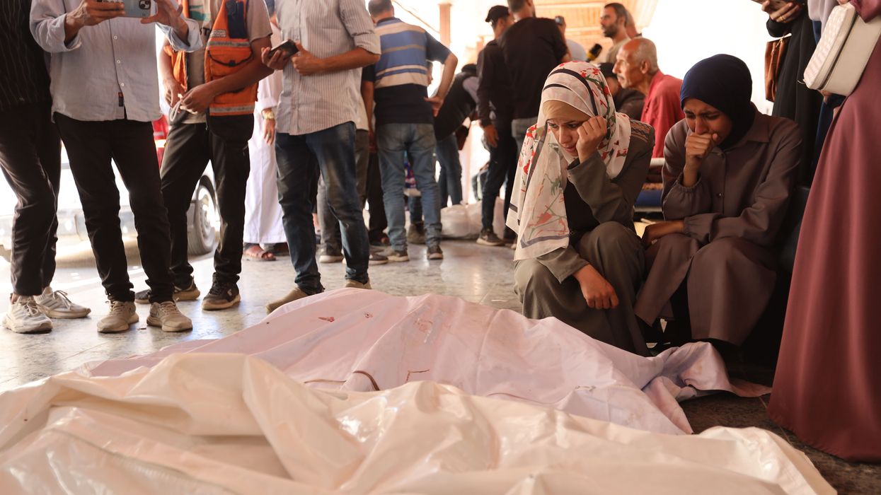 Palestinians mourn relatives killed by an Israeli attack