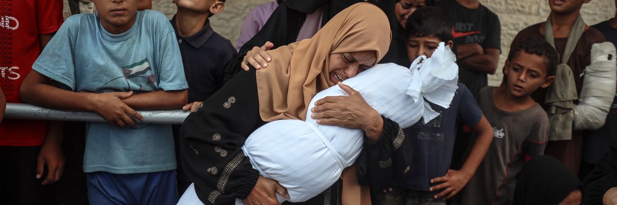 Palestinians mourn relatives killed by Israeli attack