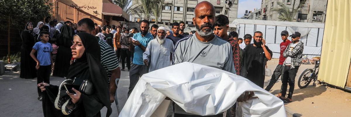 Palestinians mourn their loved ones who were killed by Israeli attacks