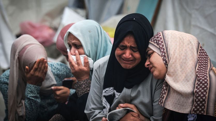 Palestinians mourn their relatives killed in an Israeli bombing