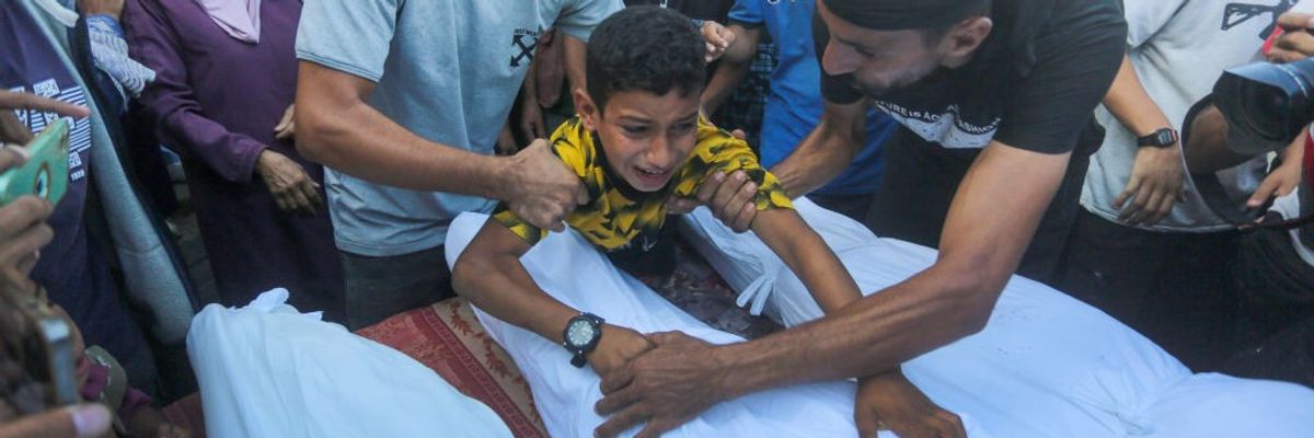 Palestinians mourn victims of Israeli attack