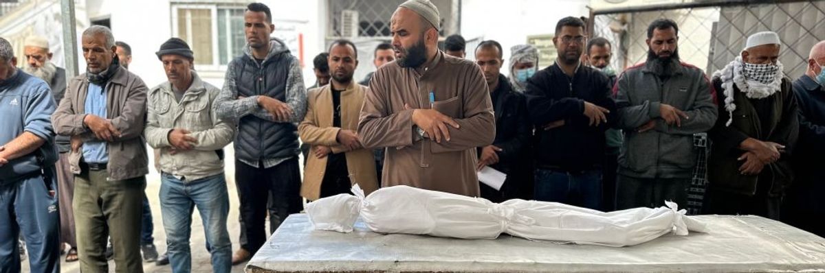 Palestinians pray for Yazan al-Kafarneh, a 10-year-old Gaza boy who died from severe malnutrition.
