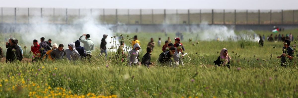 Palestinians protest near the border with Israel.