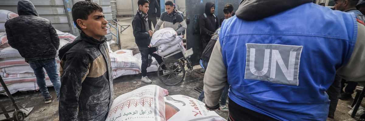 Palestinians receive aid from UNRWA