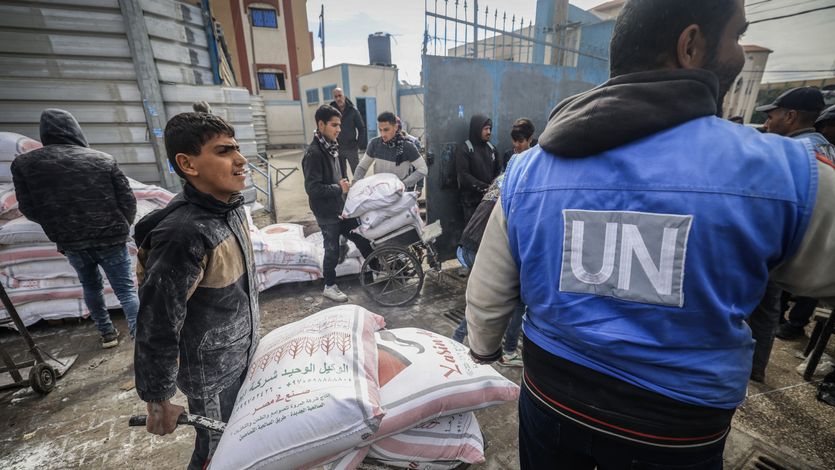 Palestinians receive aid from UNRWA