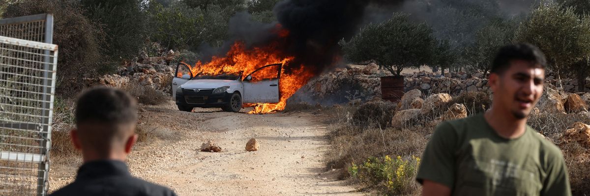 Masked Israeli Settlers Assault Palestinians, Torch Cars in West Bank