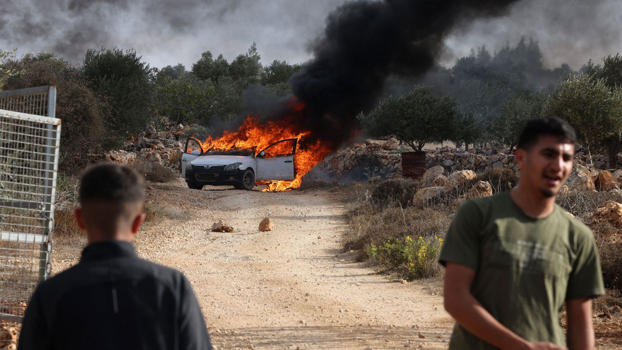 Masked Israeli Settlers Assault Palestinians, Torch Cars in West Bank