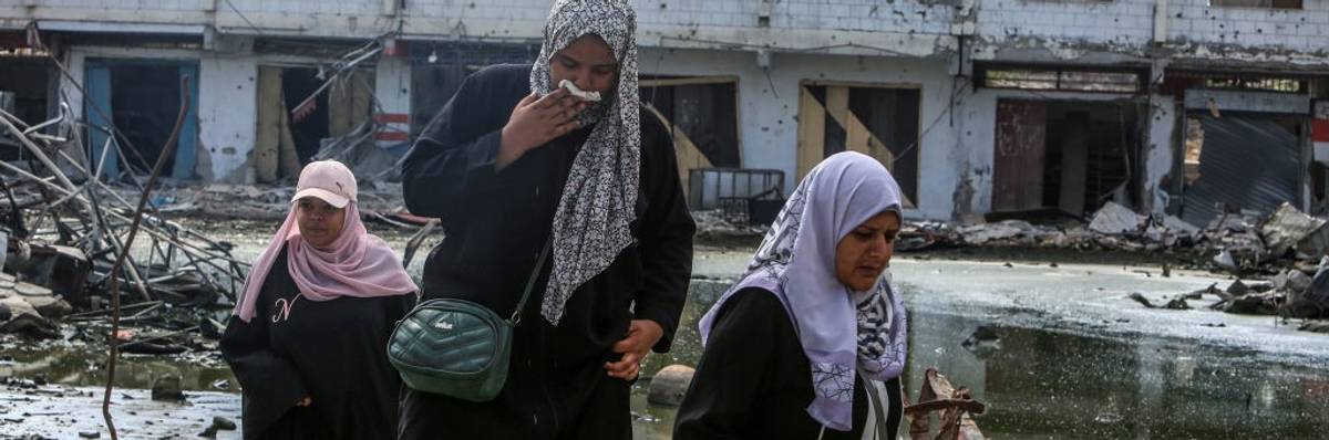 Palestinians surrounded by wastewater and rubble