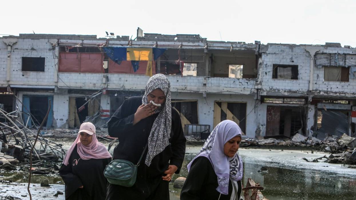 Palestinians surrounded by wastewater and rubble