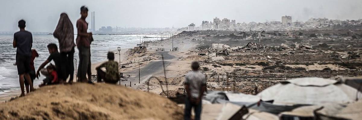Palestinians wait for the agreed ceasefire to take effect in Gaza
