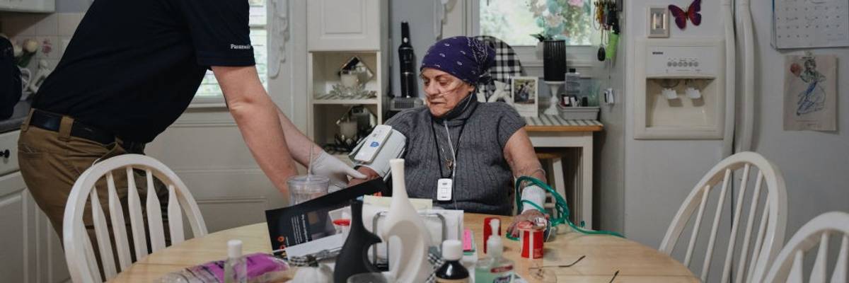 Paramedic treats home patient.