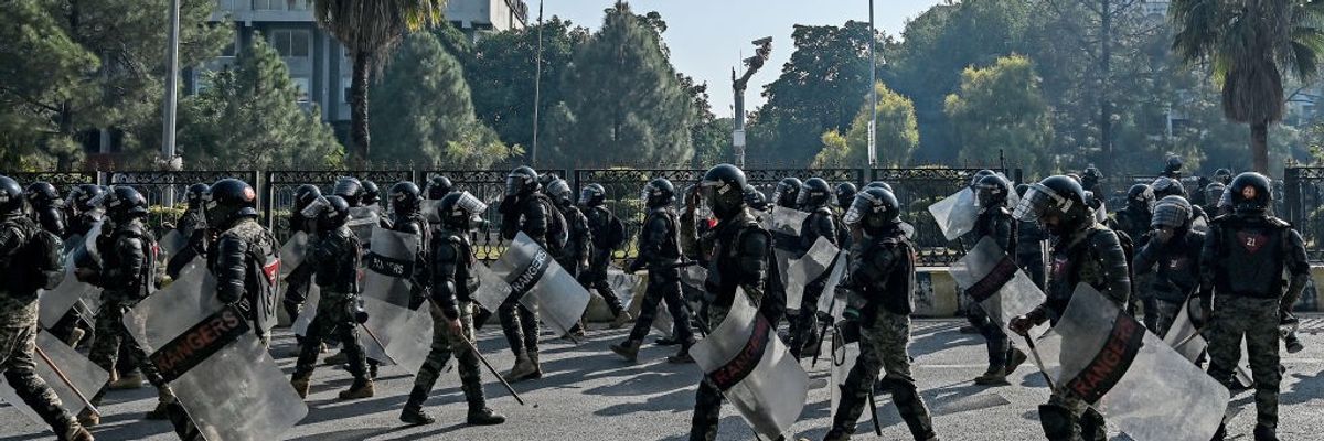 Paramilitary soldiers march to the "red zone"