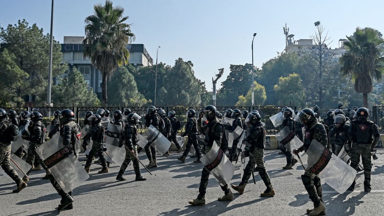 Paramilitary soldiers march to the "red zone"