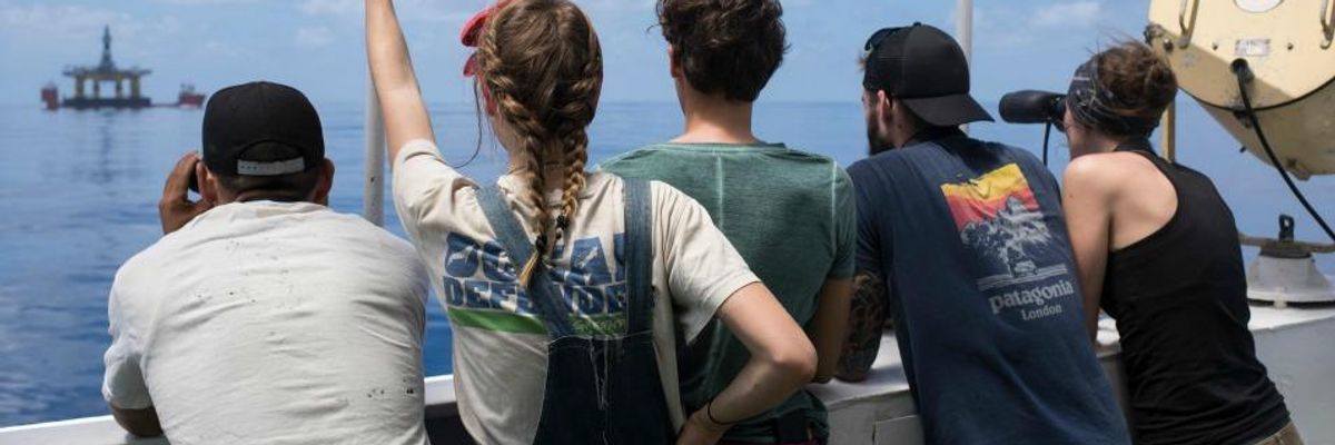 Part of the team from Greenpeace that tracked Shell's drilling rigs as they recently crossed the Pacific Ocean on their way to Arctic waters off the coast of Alaska