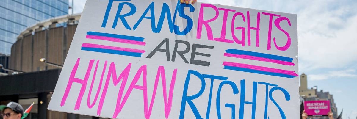 Participant seen holding a sign at the march. Thousands of