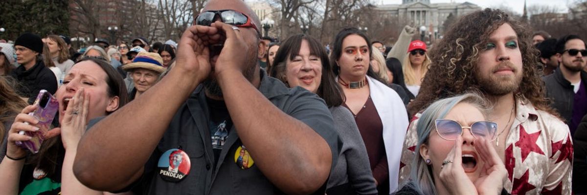 Participants cheer as U.S. Sen. Bernie Sanders