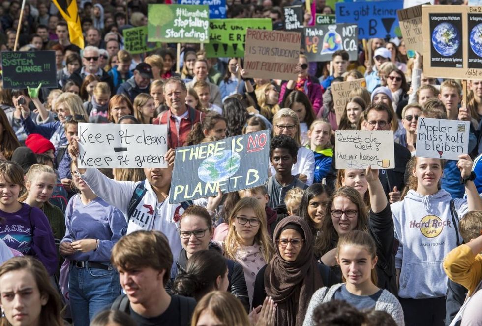 Participants in the Fridays For Future movement protest during a nationwide climate change action day in on September 20, 2019 in Frankfurt, Germany. (Photo: Thomas Lohnes/Getty Images)