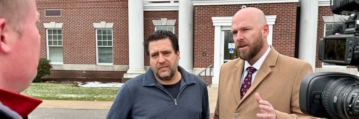Pastor Chris Avell (L) and his attorney Jeremy Dys 