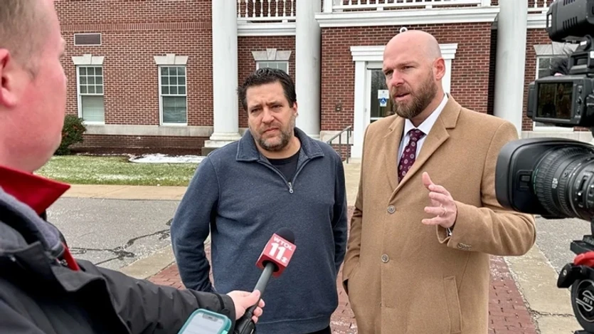 Pastor Chris Avell (L) and his attorney Jeremy Dys